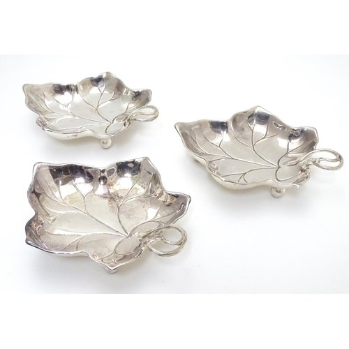 414 - Three WMF silver plated leaf-form pickle dishes with berry detail, each raised on three bun feet. WM... 