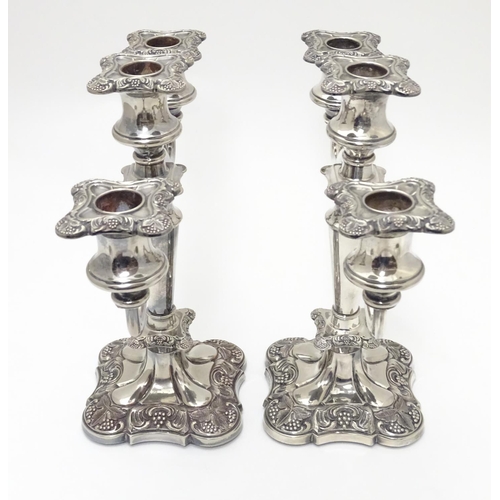 418 - A pair of silver plate candelabra with fruiting vine decoration . Approx 10