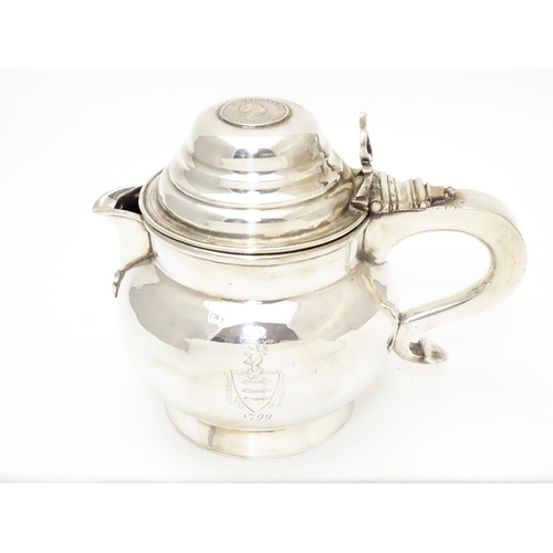 419 - An unusual silver plate jug having hinged lid set with faux Geo III coin and engraved armorial to si... 