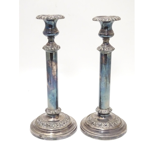 423 - A pair of silver plate candlesticks Approx. 12