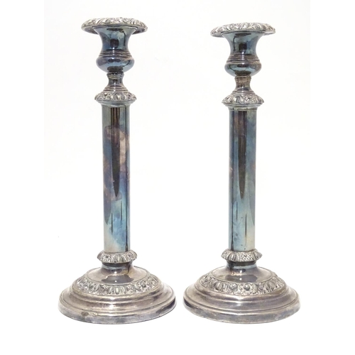 423 - A pair of silver plate candlesticks Approx. 12