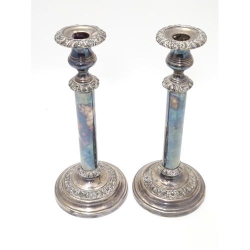 423 - A pair of silver plate candlesticks Approx. 12