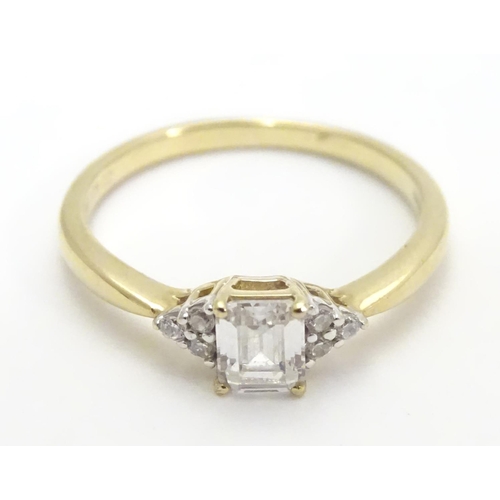 449 - A 9ct gold ring set with cubic zirconia. Ring size approx M