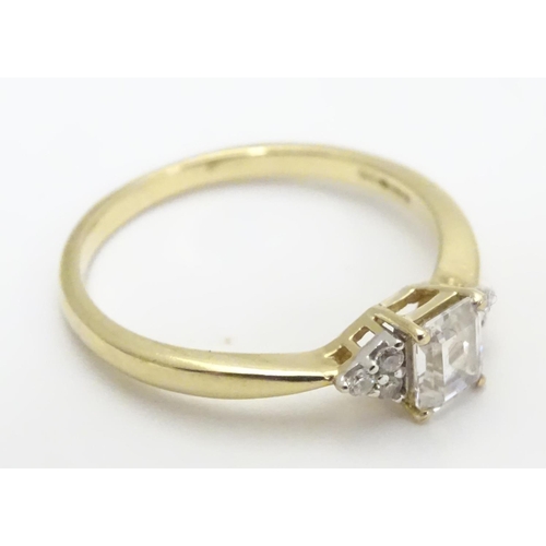 449 - A 9ct gold ring set with cubic zirconia. Ring size approx M