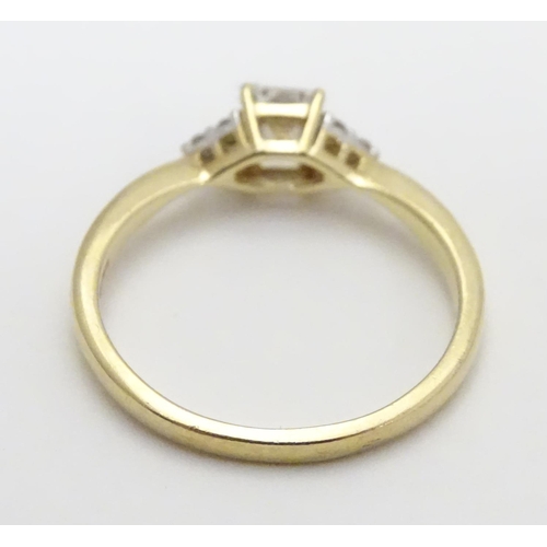 449 - A 9ct gold ring set with cubic zirconia. Ring size approx M