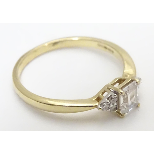 449 - A 9ct gold ring set with cubic zirconia. Ring size approx M