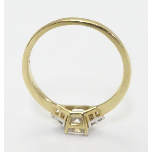 449 - A 9ct gold ring set with cubic zirconia. Ring size approx M