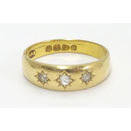 452 - A Victorian 18ct gold diamond ring set with three diamonds. Hallmarked Chester 1897. Ring size appro... 