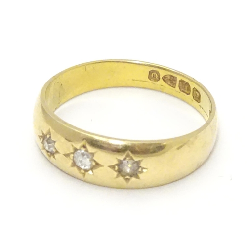 452 - A Victorian 18ct gold diamond ring set with three diamonds. Hallmarked Chester 1897. Ring size appro... 