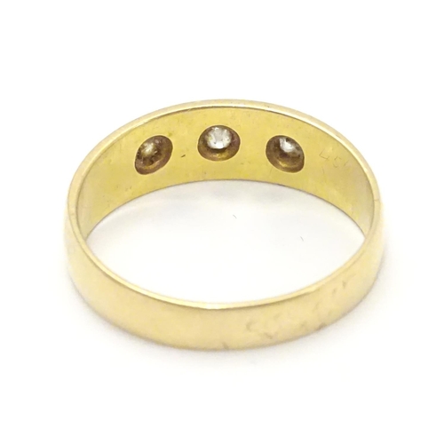 452 - A Victorian 18ct gold diamond ring set with three diamonds. Hallmarked Chester 1897. Ring size appro... 