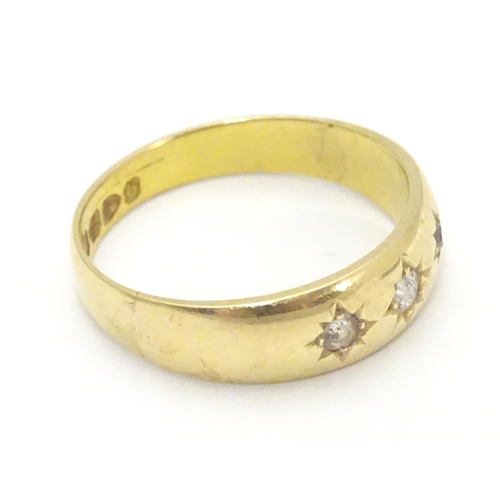 452 - A Victorian 18ct gold diamond ring set with three diamonds. Hallmarked Chester 1897. Ring size appro... 