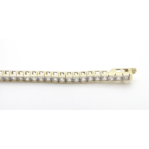 466 - A 9ct gold bracelet set with a band of white stones. Approx 7