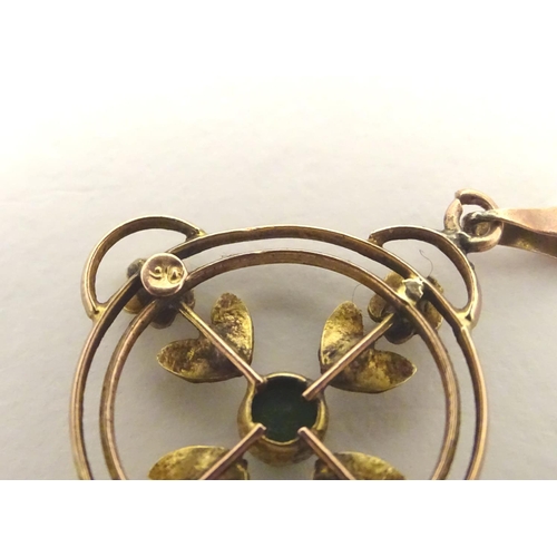 470 - A 9ct gold pendant of Edwardian suffragette manner, set with green violet and white seed pearls. The... 