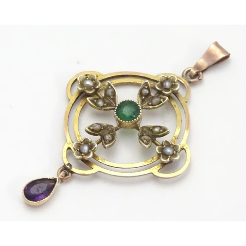 470 - A 9ct gold pendant of Edwardian suffragette manner, set with green violet and white seed pearls. The... 