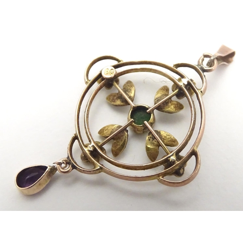 470 - A 9ct gold pendant of Edwardian suffragette manner, set with green violet and white seed pearls. The... 