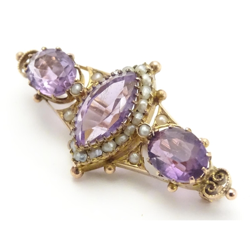 473 - A Victorian brooch set with facet cut amethyst and seed pearls 1 1/2