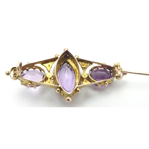 473 - A Victorian brooch set with facet cut amethyst and seed pearls 1 1/2