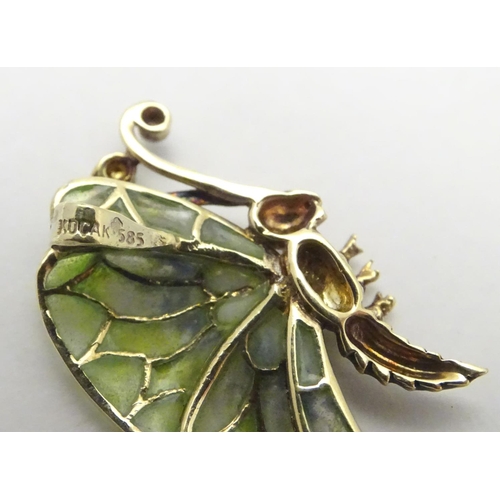 476 - A 14ct gold pendant formed as a butterfly with plique a jour detail to wings. 1 1/2