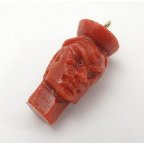 487 - A Victorian carved coral pendant charm formed as a human head 3/4