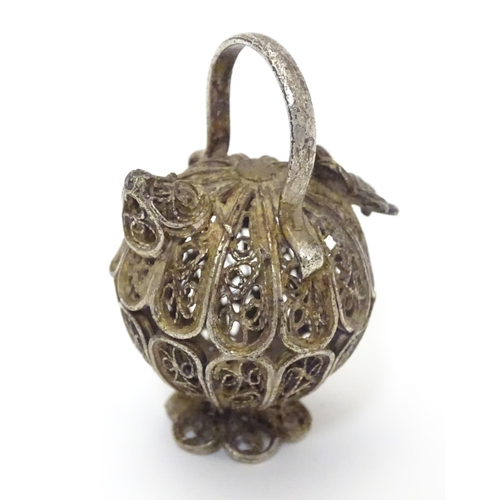 508 - A white metal pendant / model formed as a filigree jar / vessel. Approx 1 /2