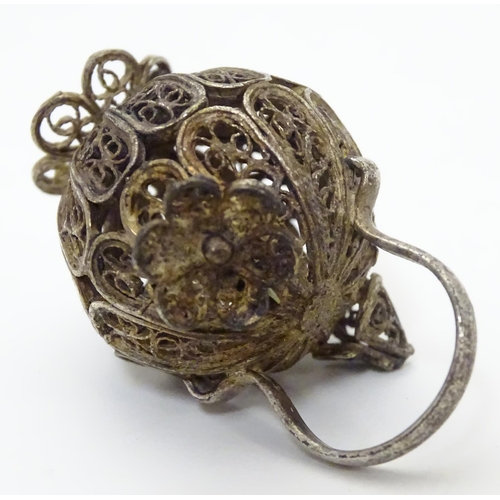 508 - A white metal pendant / model formed as a filigree jar / vessel. Approx 1 /2