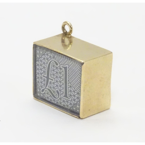 512 - A novelty 9ct gold pendant charm of squared form. Engraved ' In Emergency break glass' and containin... 