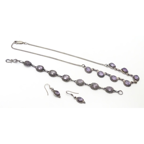 514 - A silver and amethyst suite of jewellery comprising necklace bracket and earrings