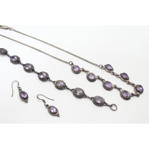 514 - A silver and amethyst suite of jewellery comprising necklace bracket and earrings