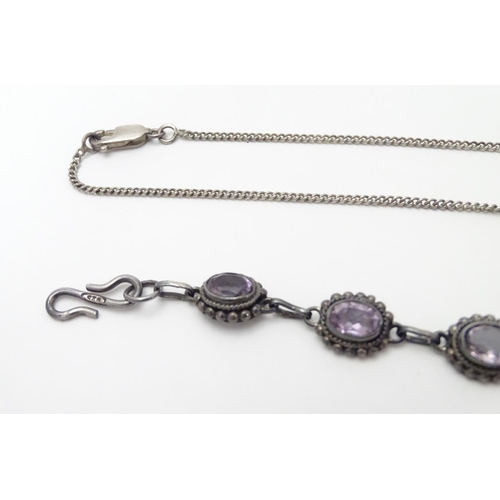 514 - A silver and amethyst suite of jewellery comprising necklace bracket and earrings