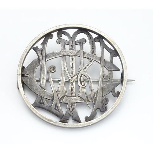 516 - A Victorian brooch of circular form within monogram cipher ' Clare' to centre. 1 1/2