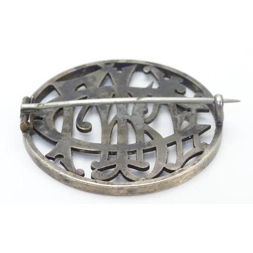 516 - A Victorian brooch of circular form within monogram cipher ' Clare' to centre. 1 1/2