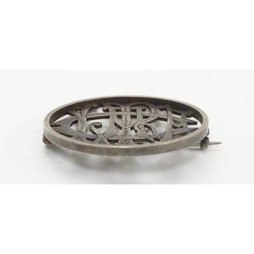 516 - A Victorian brooch of circular form within monogram cipher ' Clare' to centre. 1 1/2