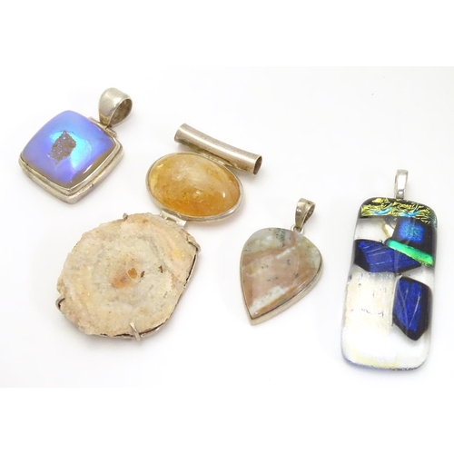 519 - Four various silver and white metal mounted pendants, including an Art Glass example 2 1/2