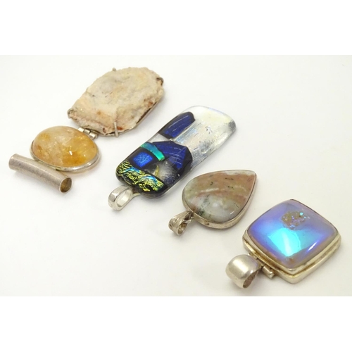 519 - Four various silver and white metal mounted pendants, including an Art Glass example 2 1/2