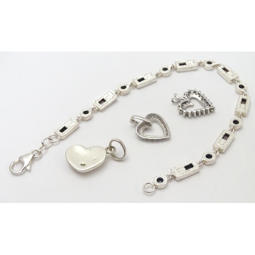 531 - A silver bracelet set with abalone shell detail  together with and 3 assorted charms (4)