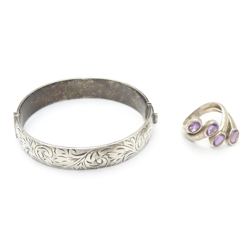 534 - A silver bracelet of bangle form Hallmarked Birmingham 1974 together with a silver dress ring set wi... 