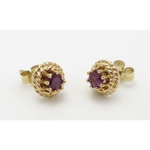 544 - A pair of 9ct stud earring set with red spinel 1/4