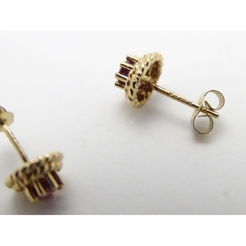 544 - A pair of 9ct stud earring set with red spinel 1/4