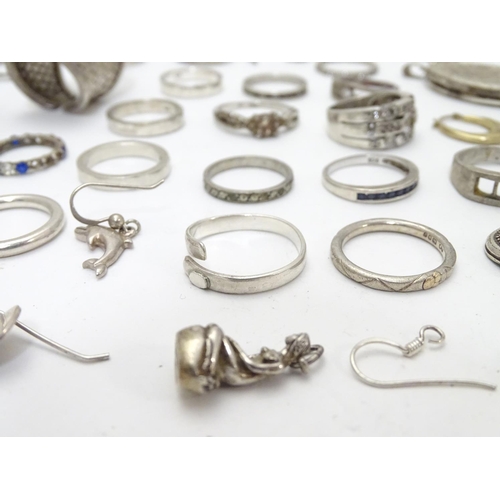 548 - Assorted silver jewellery to include rings, earrings, pendant bracket etc. Some silver examples.