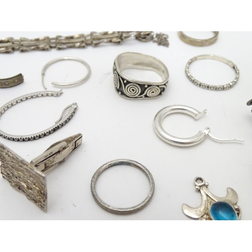 548 - Assorted silver jewellery to include rings, earrings, pendant bracket etc. Some silver examples.