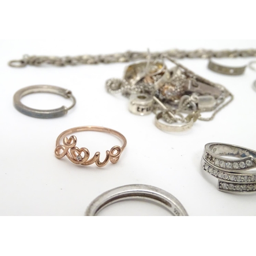 548 - Assorted silver jewellery to include rings, earrings, pendant bracket etc. Some silver examples.