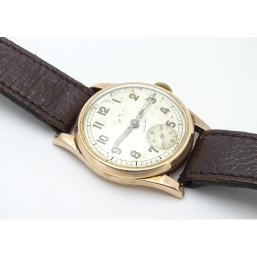 557 - An early 20thC J W Benson , London wrist watch, with Audemars movement and 9ct gold case.