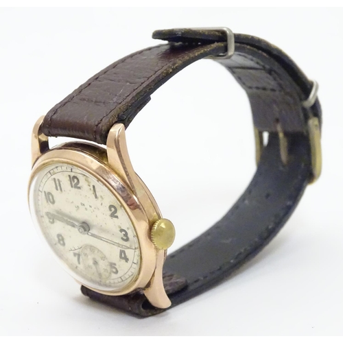 557 - An early 20thC J W Benson , London wrist watch, with Audemars movement and 9ct gold case.