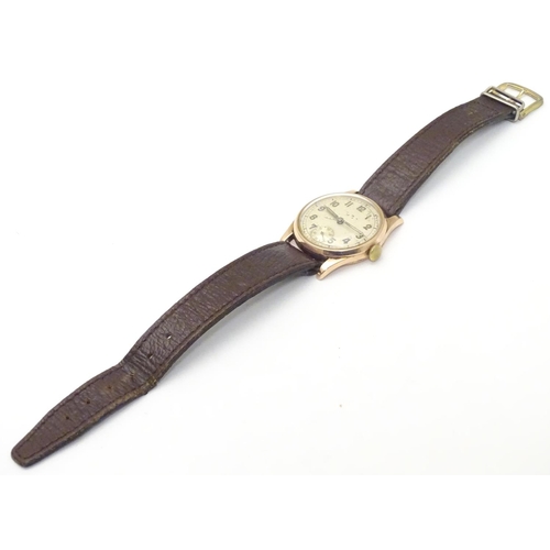 557 - An early 20thC J W Benson , London wrist watch, with Audemars movement and 9ct gold case.