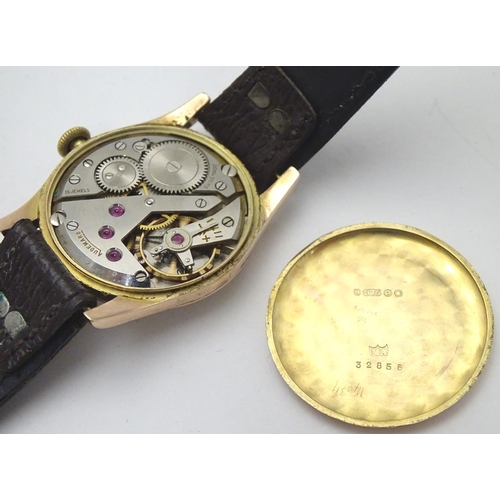 557 - An early 20thC J W Benson , London wrist watch, with Audemars movement and 9ct gold case.