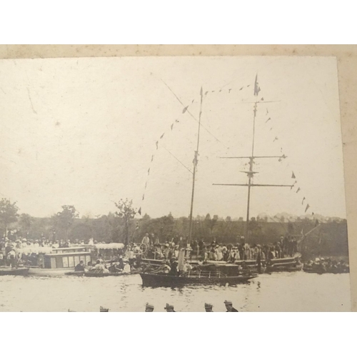 674 - An early 20thC monochrome photograph depicting a rowing Regatta, a passing racing boat with crew of ... 