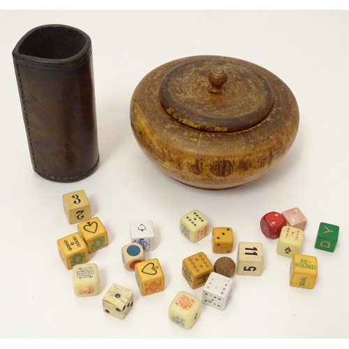 696 - Toys: A treen 19thC turned fruitwood pot and cover containing an assortment of dice, together with a... 