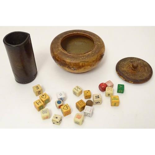 696 - Toys: A treen 19thC turned fruitwood pot and cover containing an assortment of dice, together with a... 