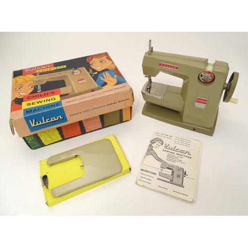 698 - Toy: A 20thC Vulcan Countess child's sewing machine, hand operated. With original box and instructio... 