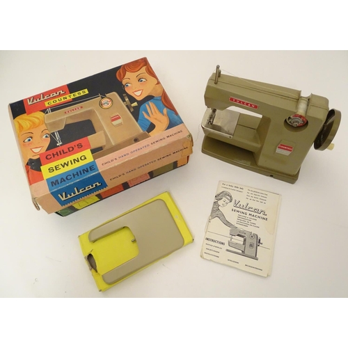 698 - Toy: A 20thC Vulcan Countess child's sewing machine, hand operated. With original box and instructio... 